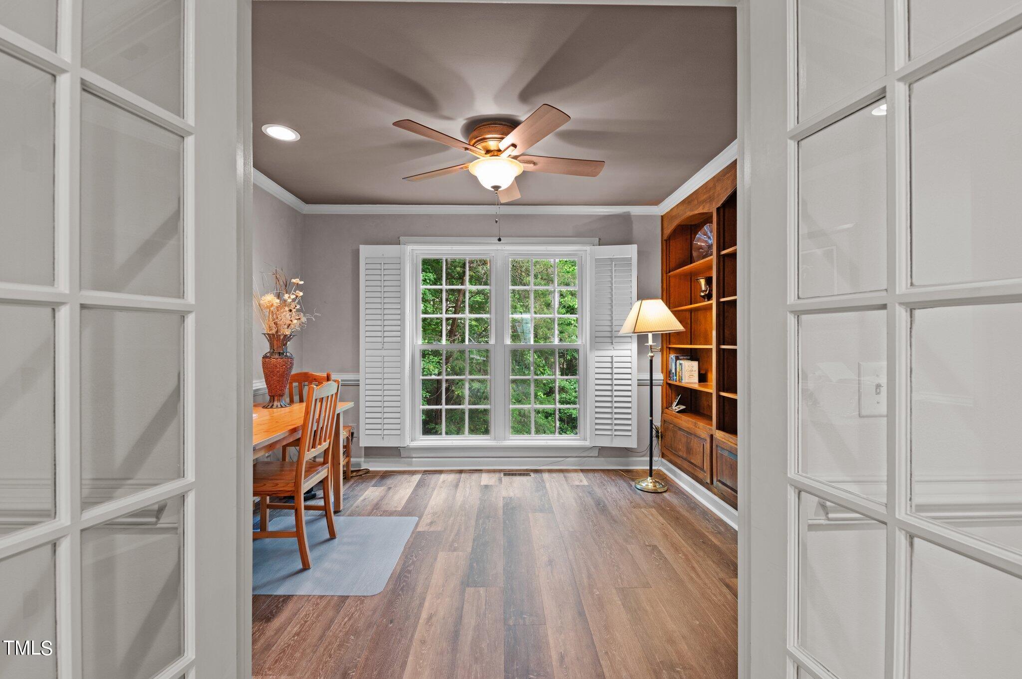 8116 Coleraine Court Raleigh, NC 27615 - Photo 14 of 58 a view of a livingroom with wooden floor and a window