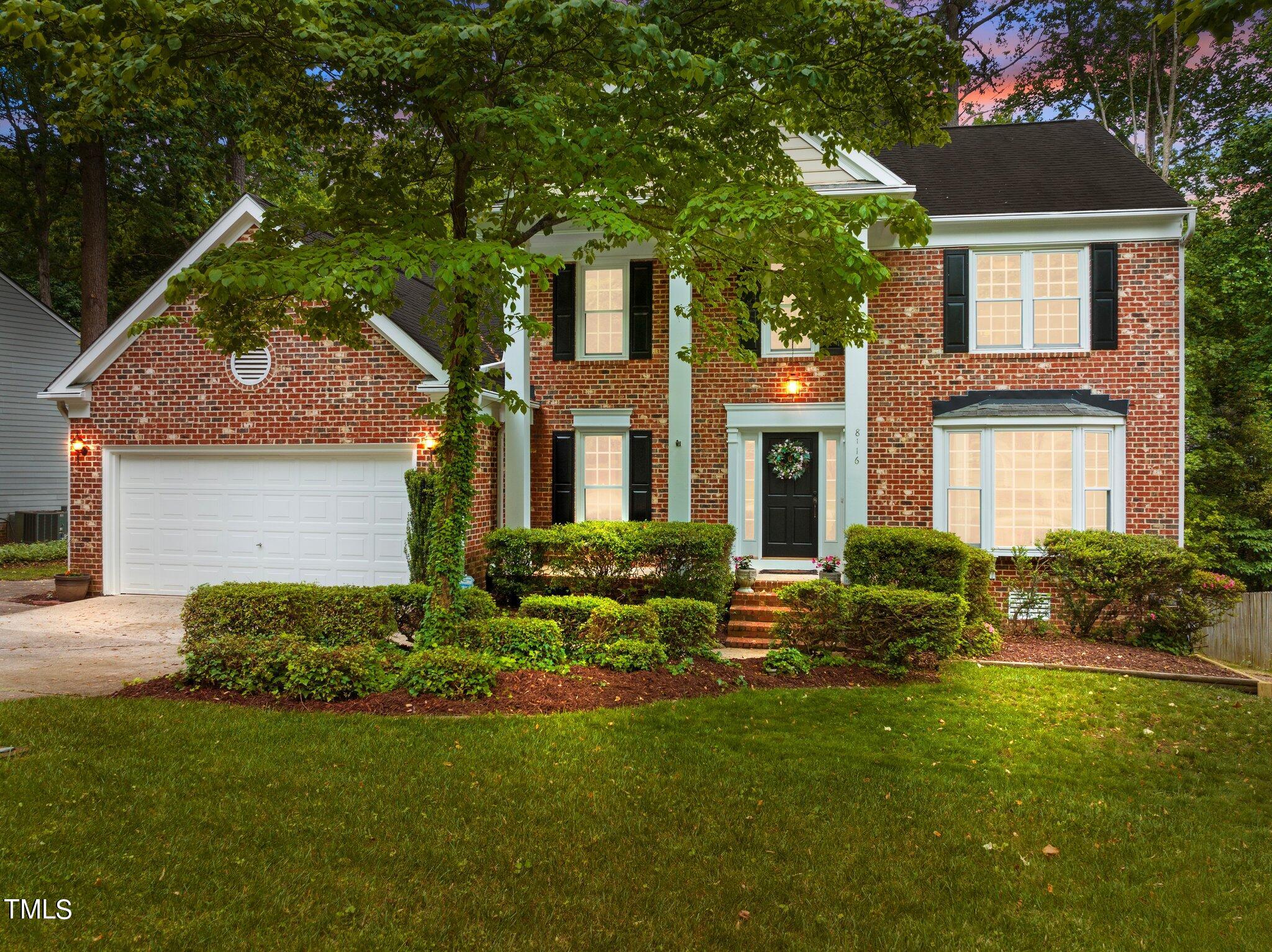 8116 Coleraine Court Raleigh, NC 27615 - Photo 54 of 58 a front view of house with yard and green space