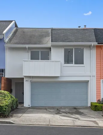 a front view of a house with garage