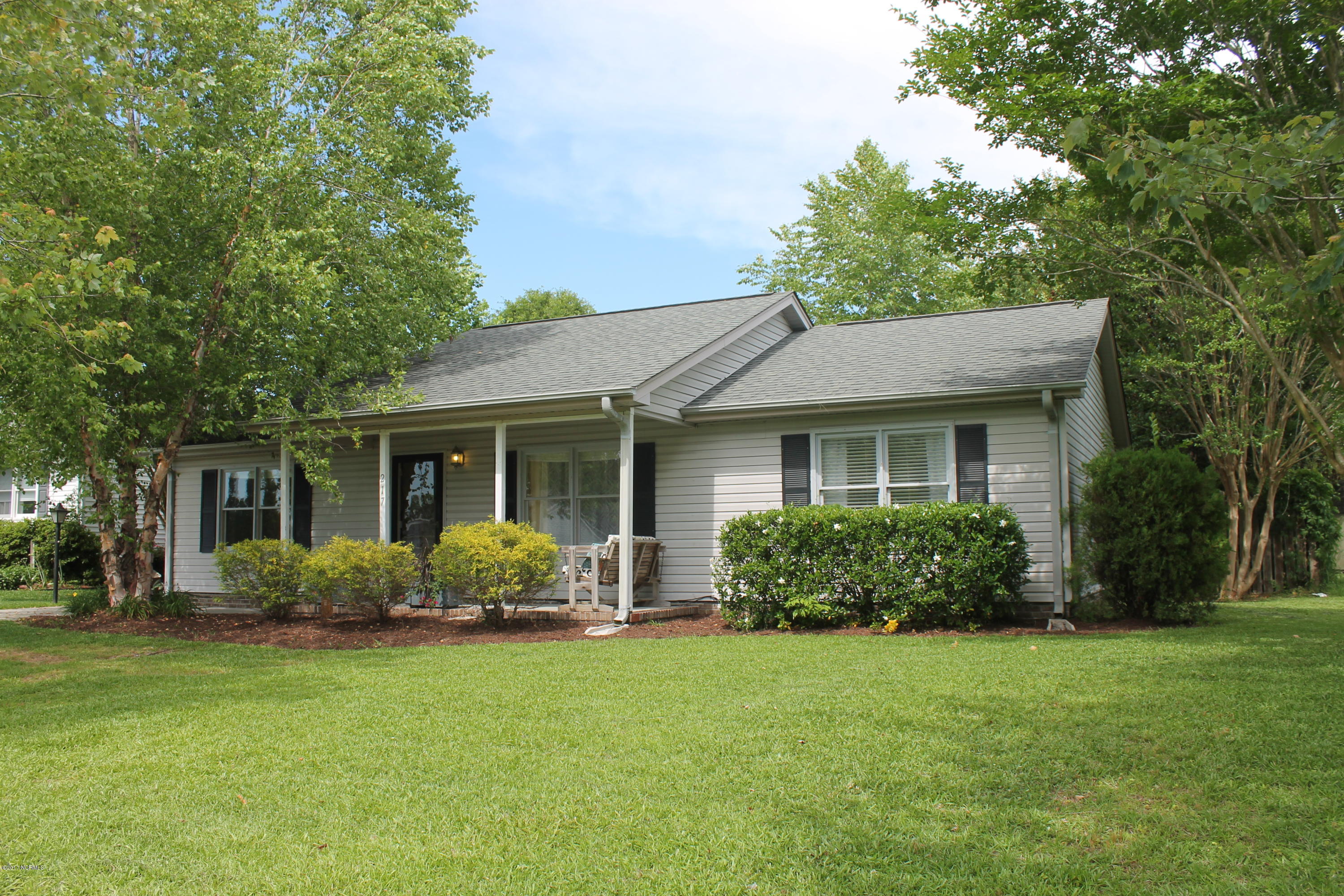 217 Fairford Road Castle Hayne, NC 28429 - Photo 1 of 17 Nicely landscaped lot with mature trees. Driveway to left.