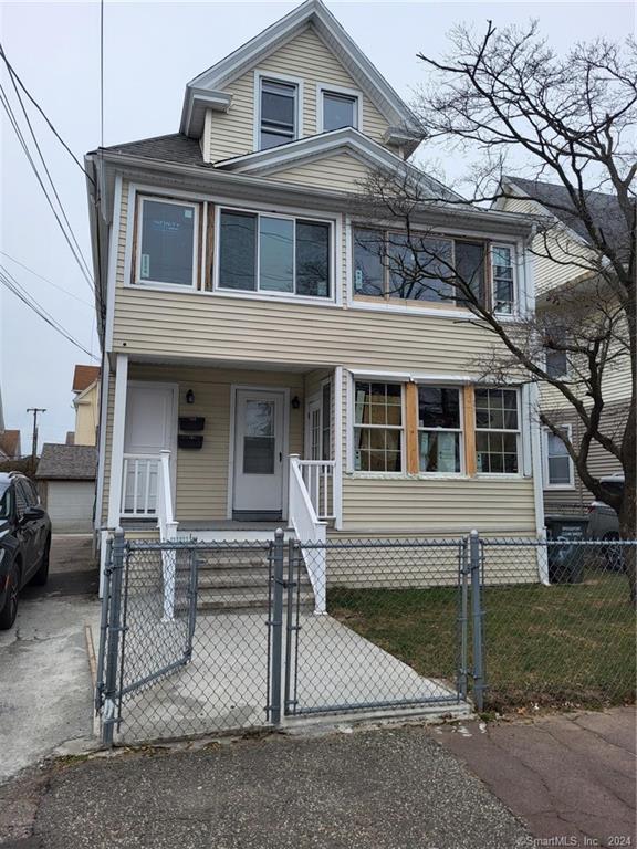 191 Parrott Avenue, Unit 3 Bridgeport, CT 06606 - Photo 1 of 1 a front view of a house with a garage