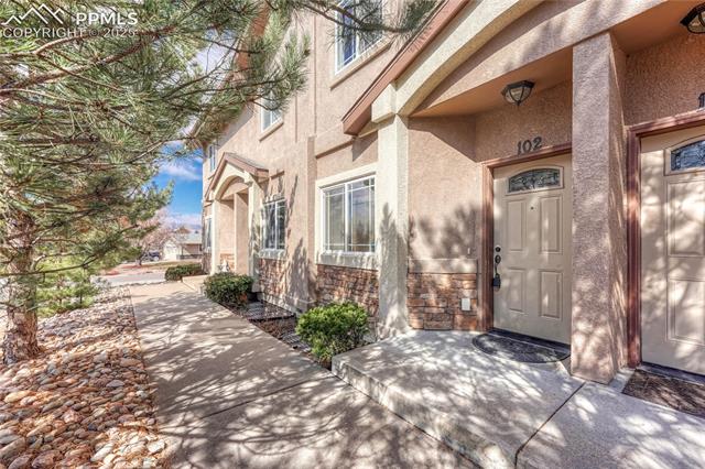 1502 York Road, Unit 102 Colorado Springs, CO 80920 - Photo 2 of 29 Doorway to property featuring stucco siding