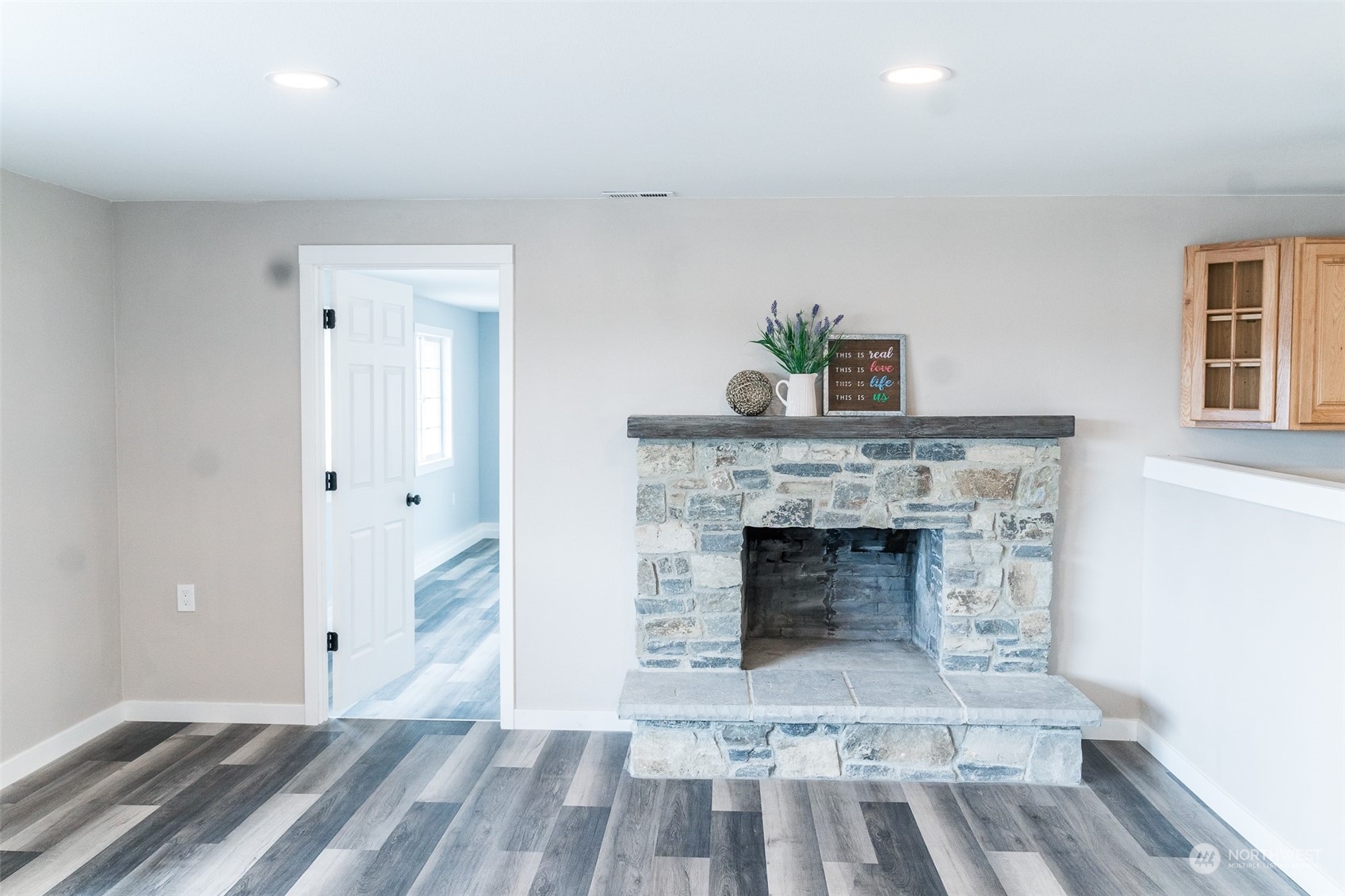 4820 176th Avenue Southwest Rochester, WA 98579 - Photo 11 of 40 a living room with a fireplace and wooden floor