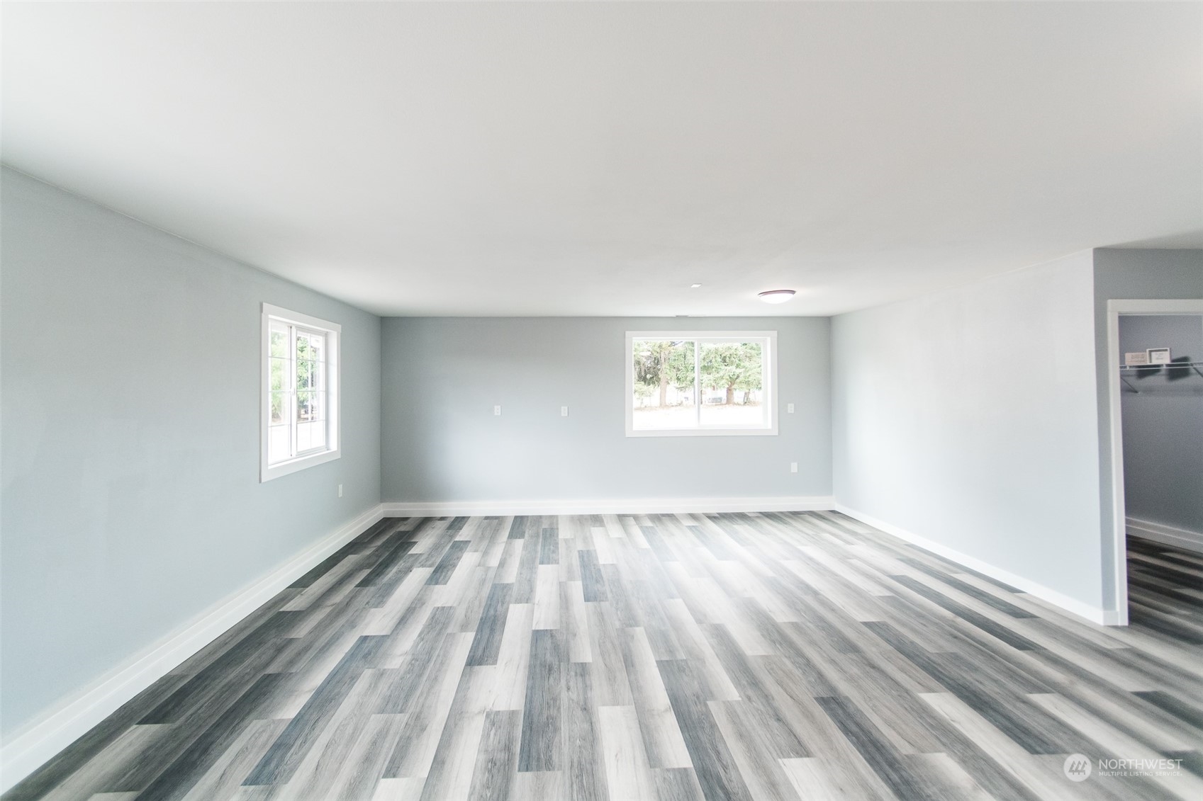 4820 176th Avenue Southwest Rochester, WA 98579 - Photo 16 of 40 an empty room with windows