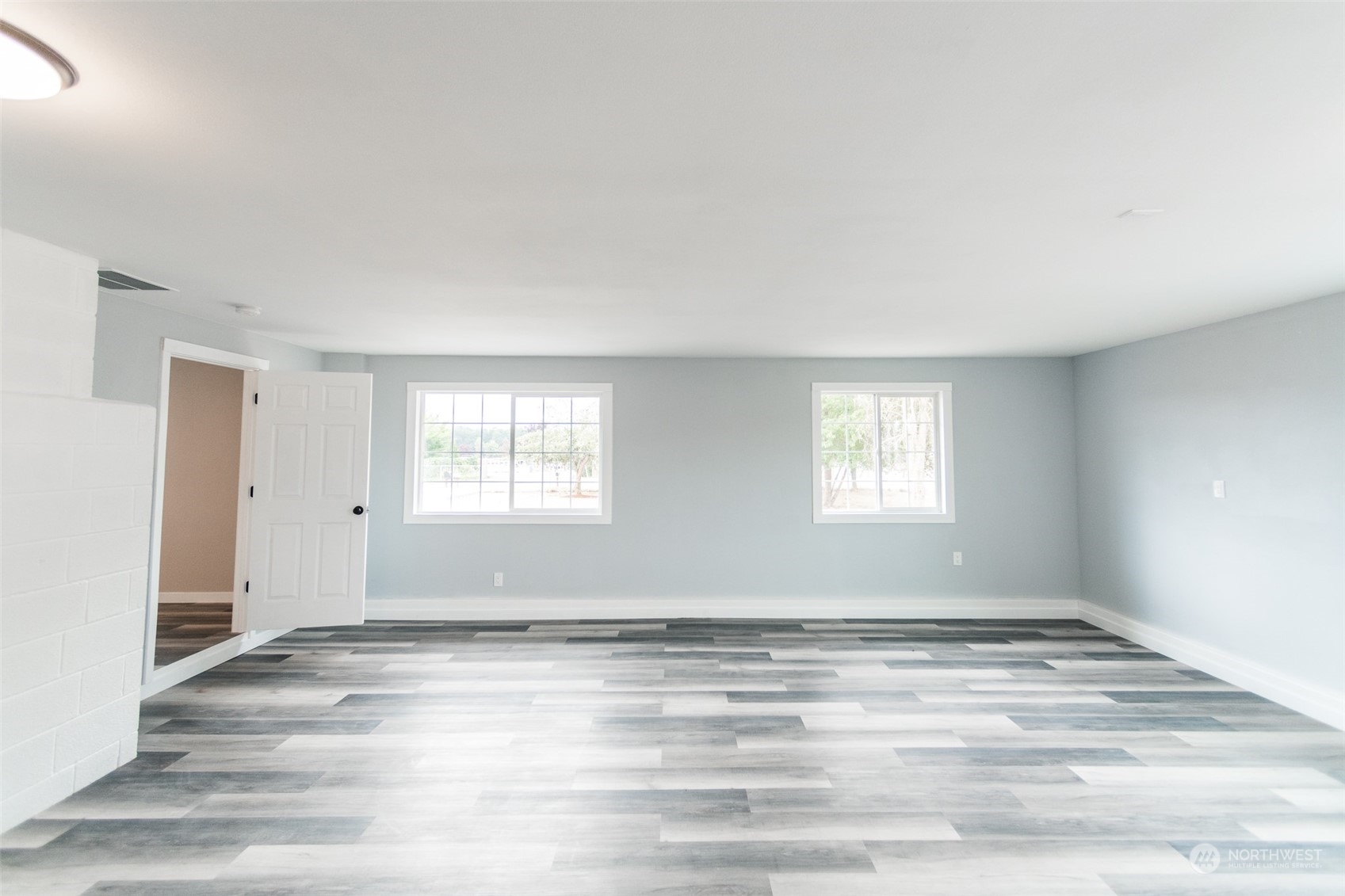 4820 176th Avenue Southwest Rochester, WA 98579 - Photo 17 of 40 a view of a room with wooden floor and window