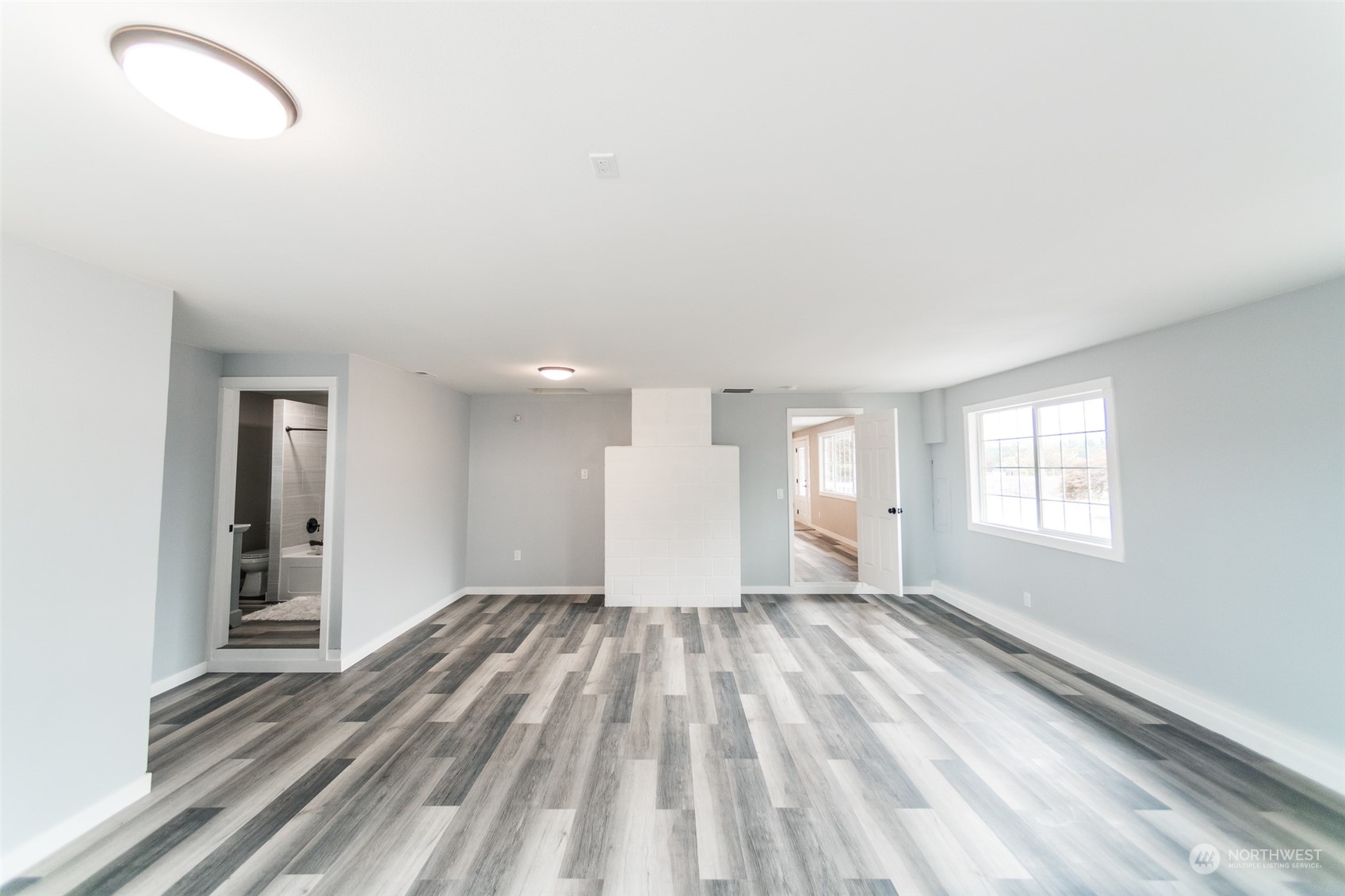 4820 176th Avenue Southwest Rochester, WA 98579 - Photo 19 of 40 an empty room with windows