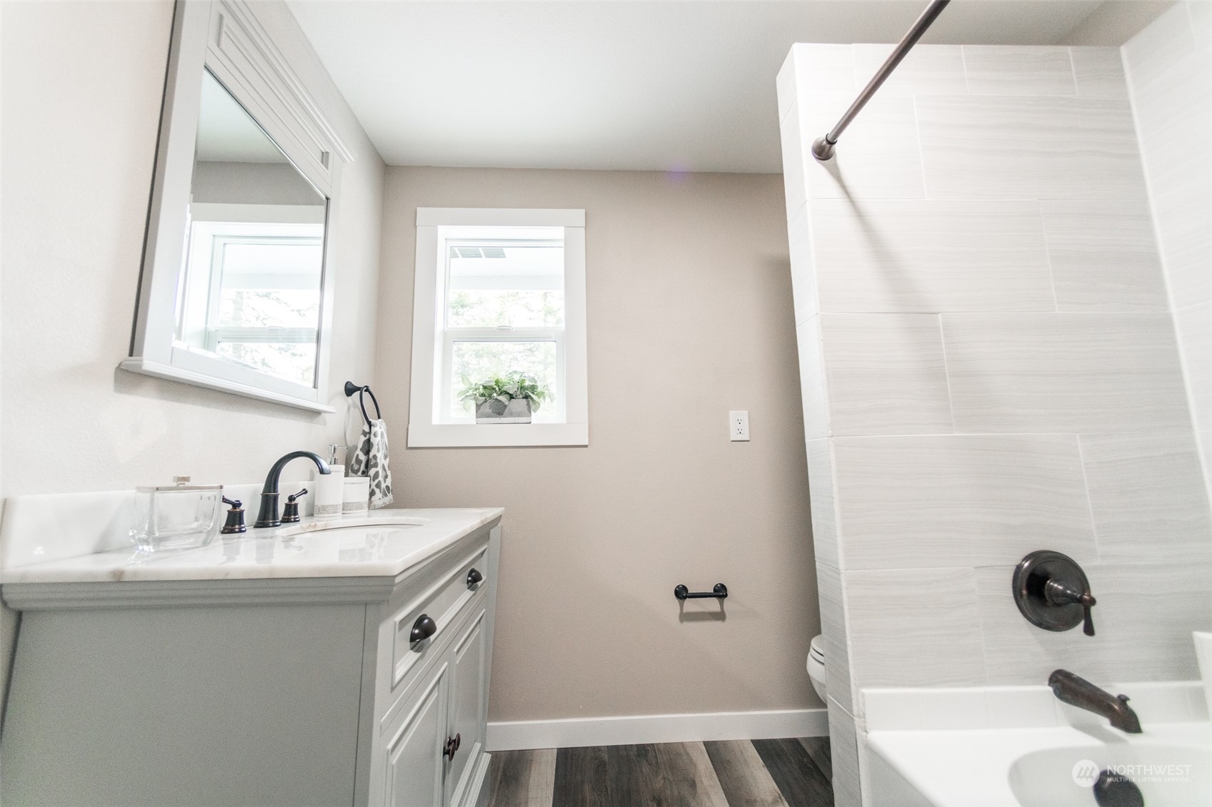 4820 176th Avenue Southwest Rochester, WA 98579 - Photo 21 of 40 a bathroom with a sink a toilet a mirror and shower