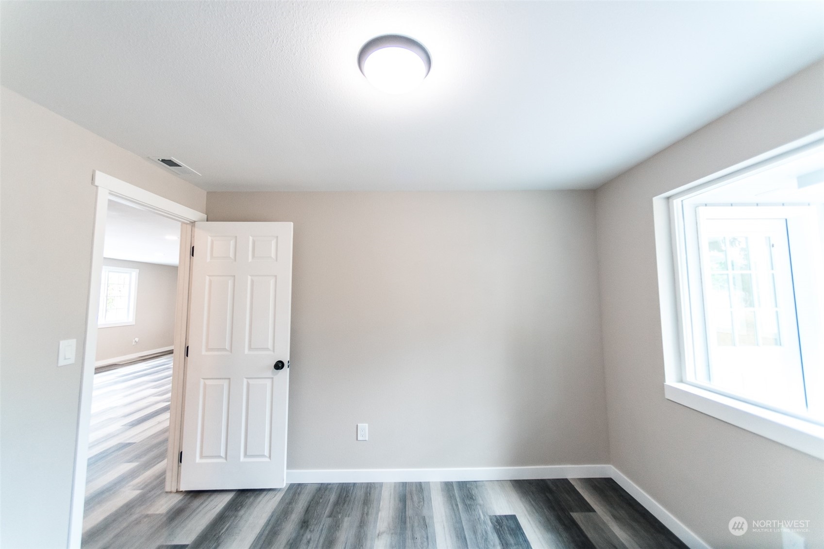 4820 176th Avenue Southwest Rochester, WA 98579 - Photo 25 of 40 wooden floor in an empty room with a window