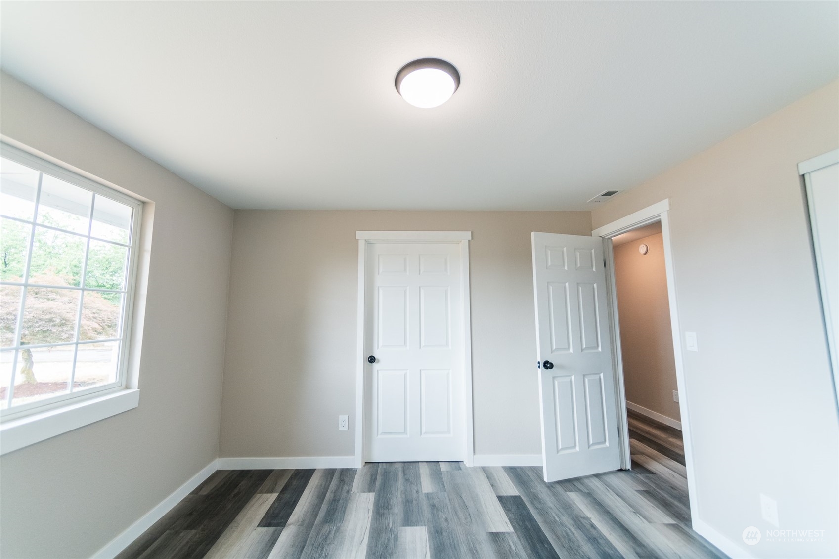4820 176th Avenue Southwest Rochester, WA 98579 - Photo 28 of 40 a view of empty room with wooden floor
