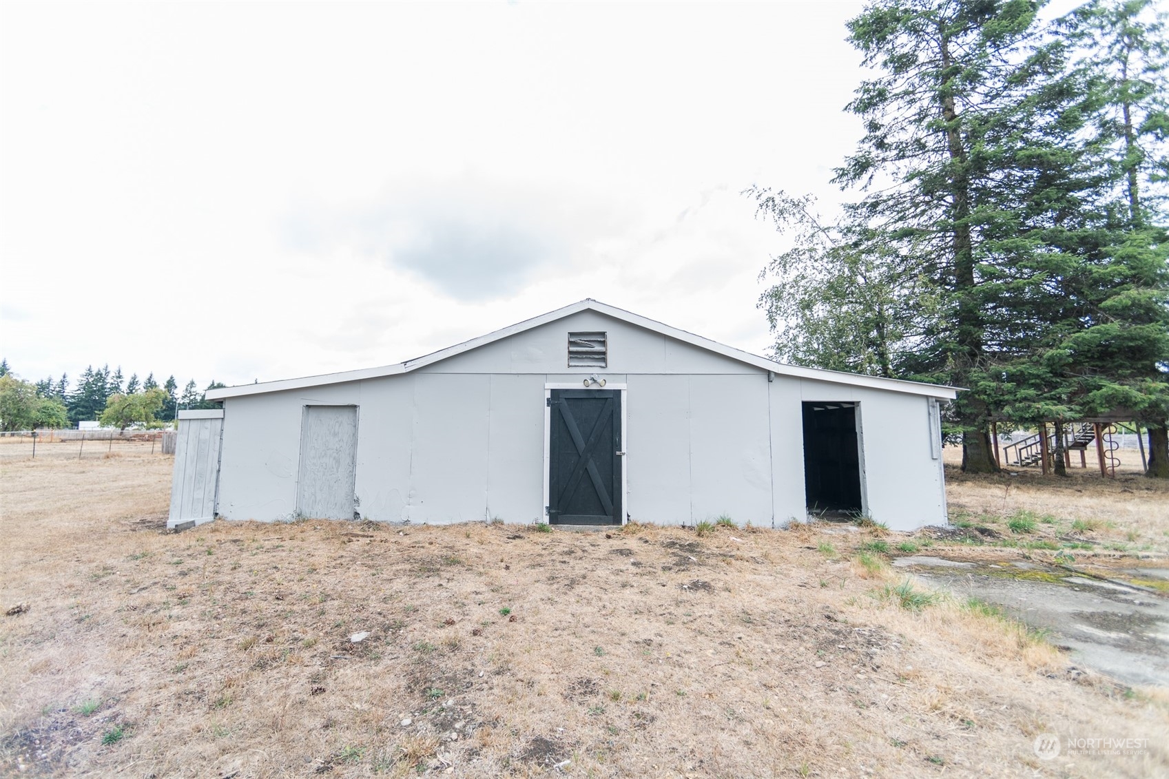 4820 176th Avenue Southwest Rochester, WA 98579 - Photo 31 of 40 a view of backyard with large tree