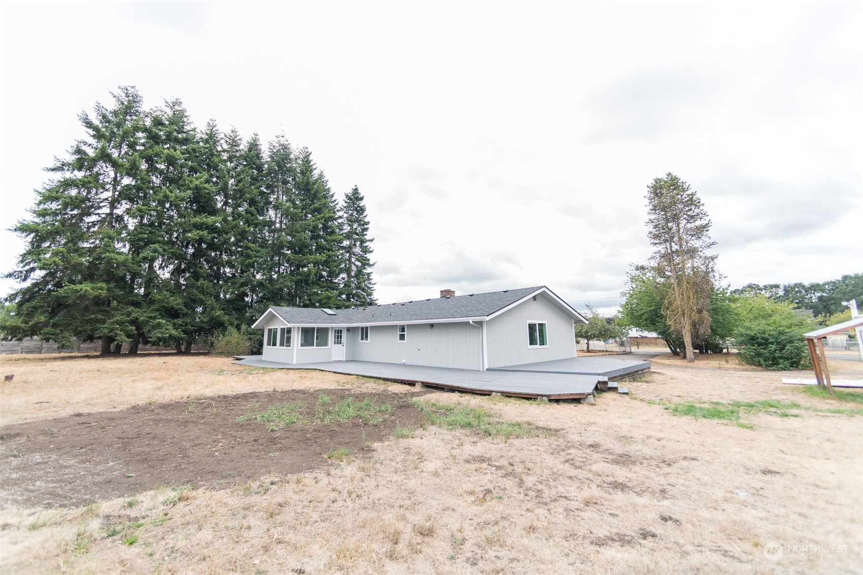 4820 176th Avenue Southwest Rochester, WA 98579 - Photo 39 of 40 a view of house with backyard and tree