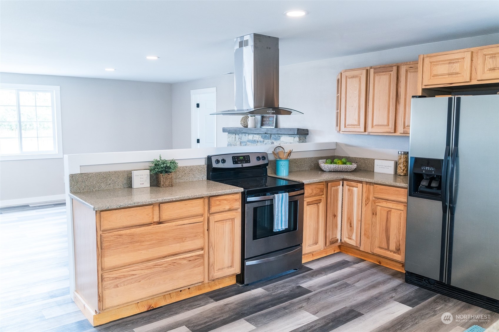 4820 176th Avenue Southwest Rochester, WA 98579 - Photo 8 of 40 a kitchen with stainless steel appliances granite countertop a refrigerator a stove a sink and a microwave