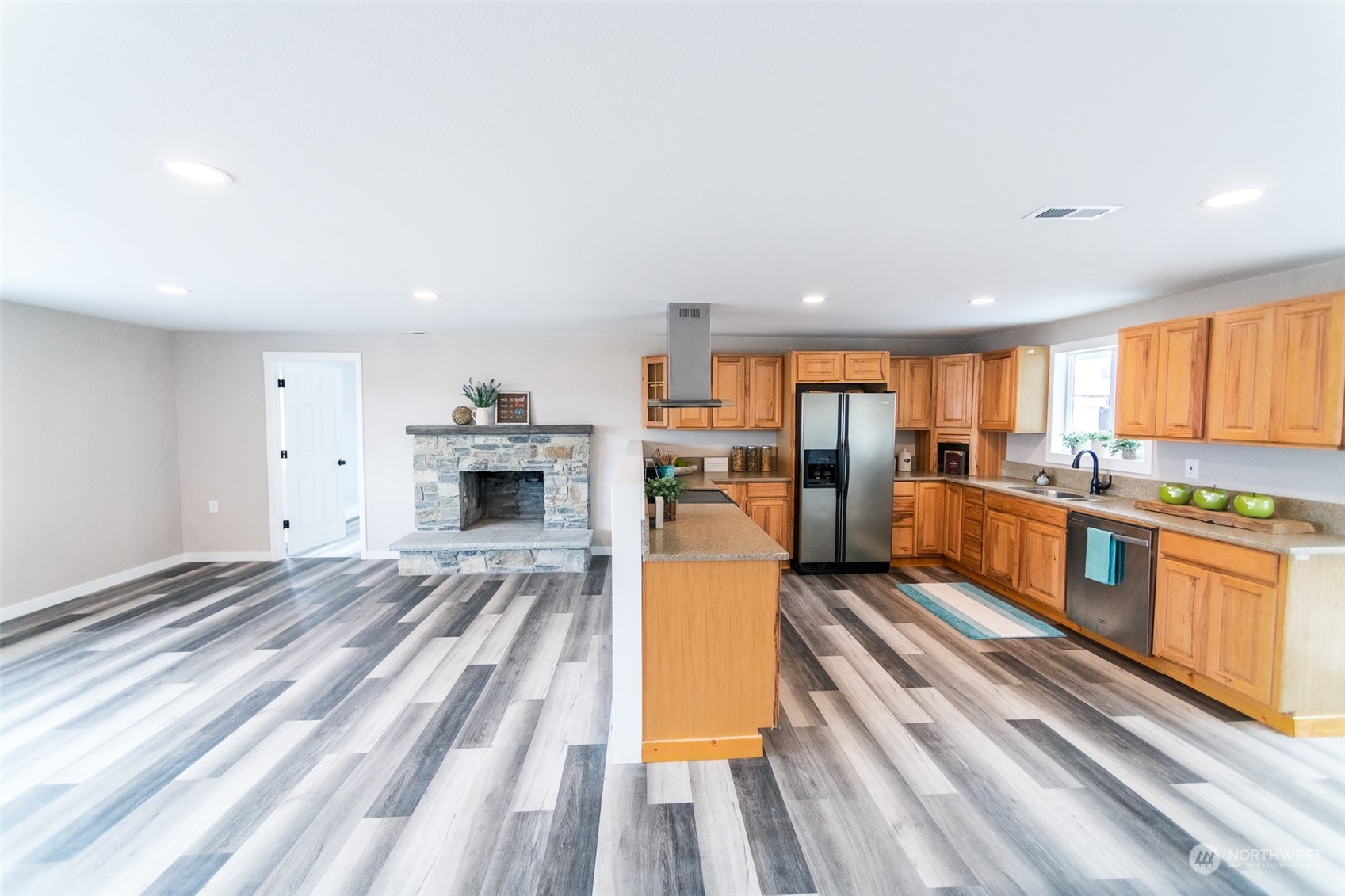 4820 176th Avenue Southwest Rochester, WA 98579 - Photo 10 of 40 a large living room with stainless steel appliances granite countertop furniture and a kitchen view