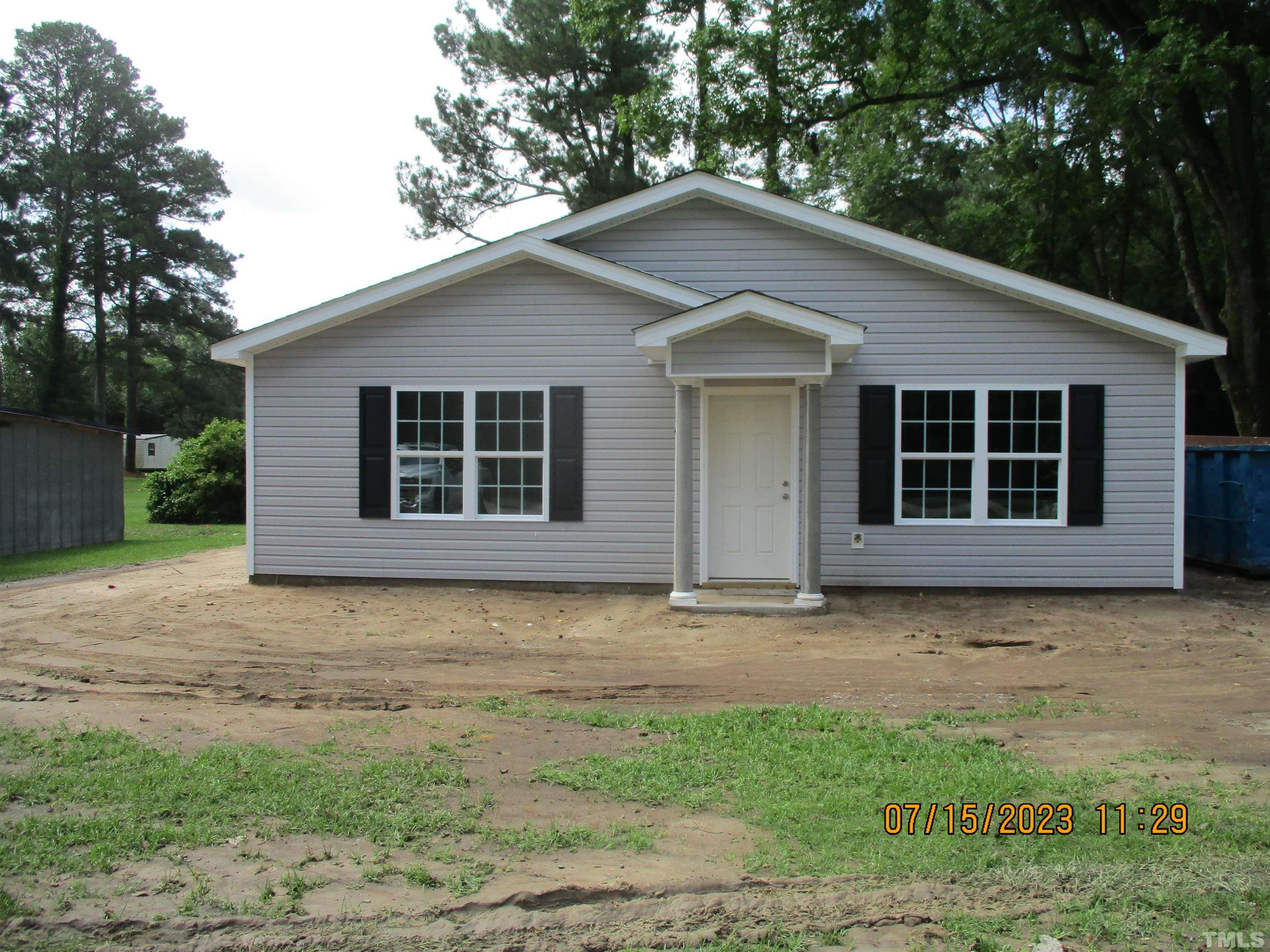 592 Rowan Road Clinton, NC 28328 - Photo 2 of 9 a house with a yard