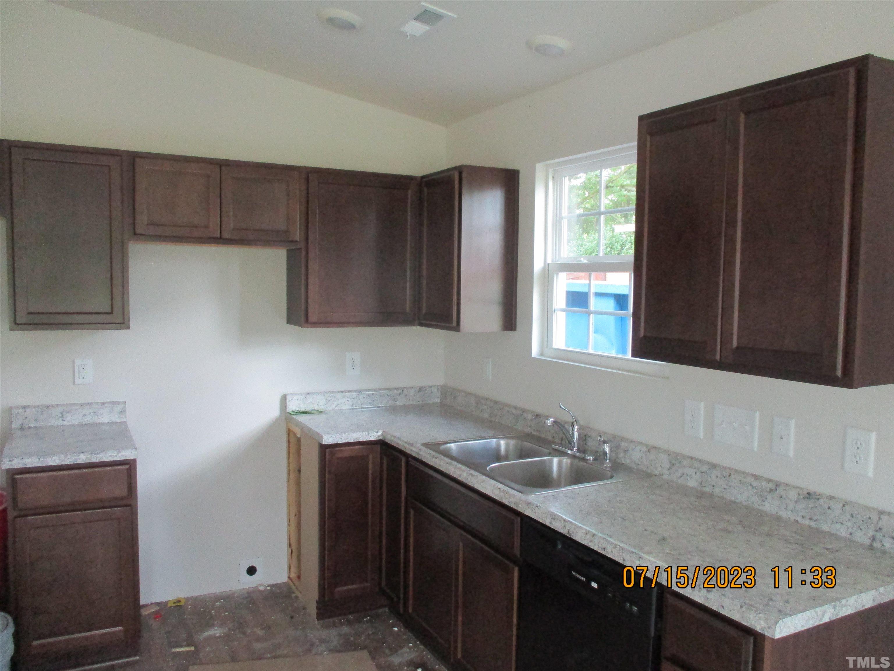 592 Rowan Road Clinton, NC 28328 - Photo 3 of 9 a kitchen with a sink and cabinets
