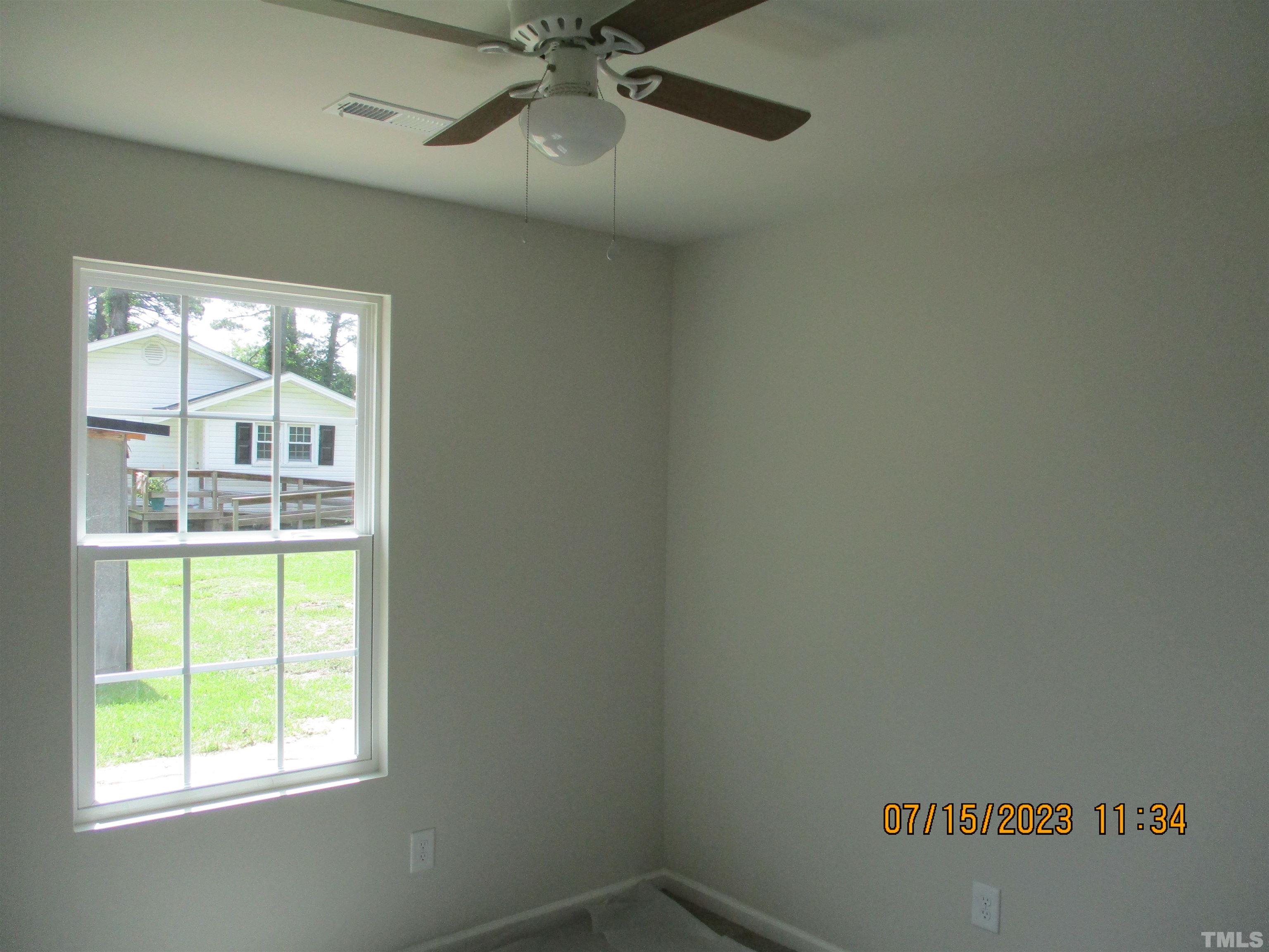 592 Rowan Road Clinton, NC 28328 - Photo 6 of 9 a view of empty room with window