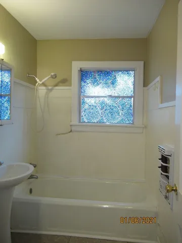 a bathroom with a shower and a toilet