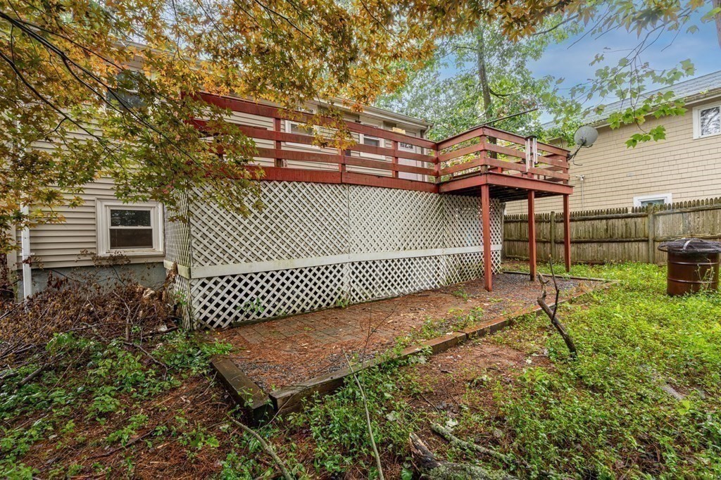 41 Juniper Road Holbrook, MA 02343 - Photo 20 of 24 a view of a yard with plants and wooden fence