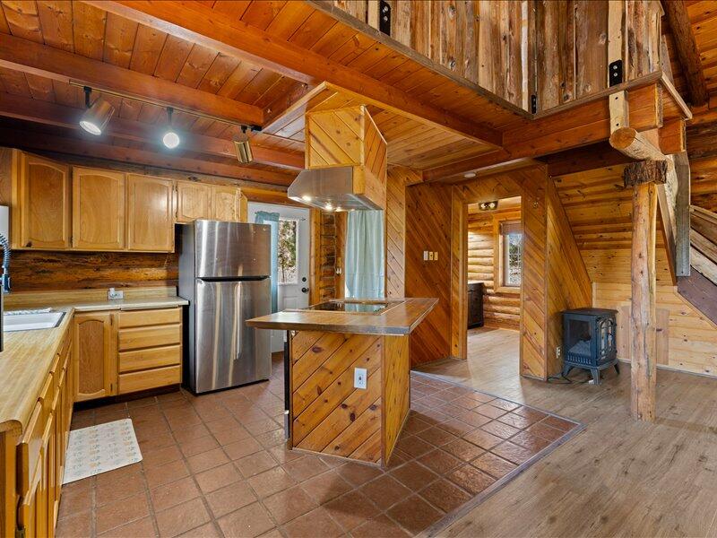 40060 Incline Drive Chiloquin, OR 97624 - Photo 8 of 26 a kitchen with refrigerator and cabinets