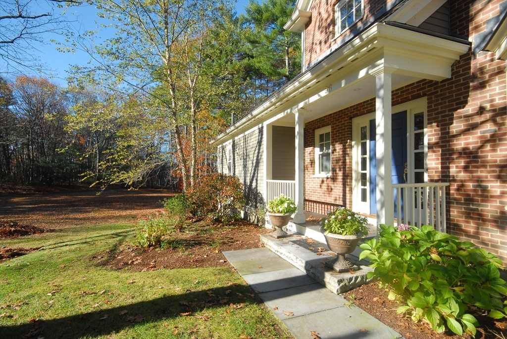 96 Forest Ridge Road, Unit 96 Concord, MA 01742 - Photo 36 of 36 a view of a house with swimming pool and sitting area