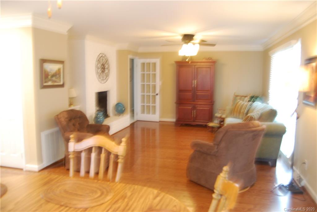 2716 Stack Road Monroe, NC 28112 - Photo 14 of 42 a living room with furniture and a chandelier