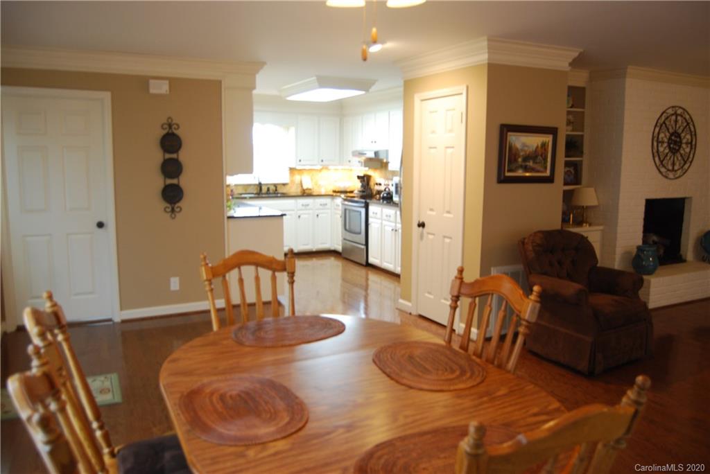 2716 Stack Road Monroe, NC 28112 - Photo 15 of 42 a dining room with furniture and wooden floor