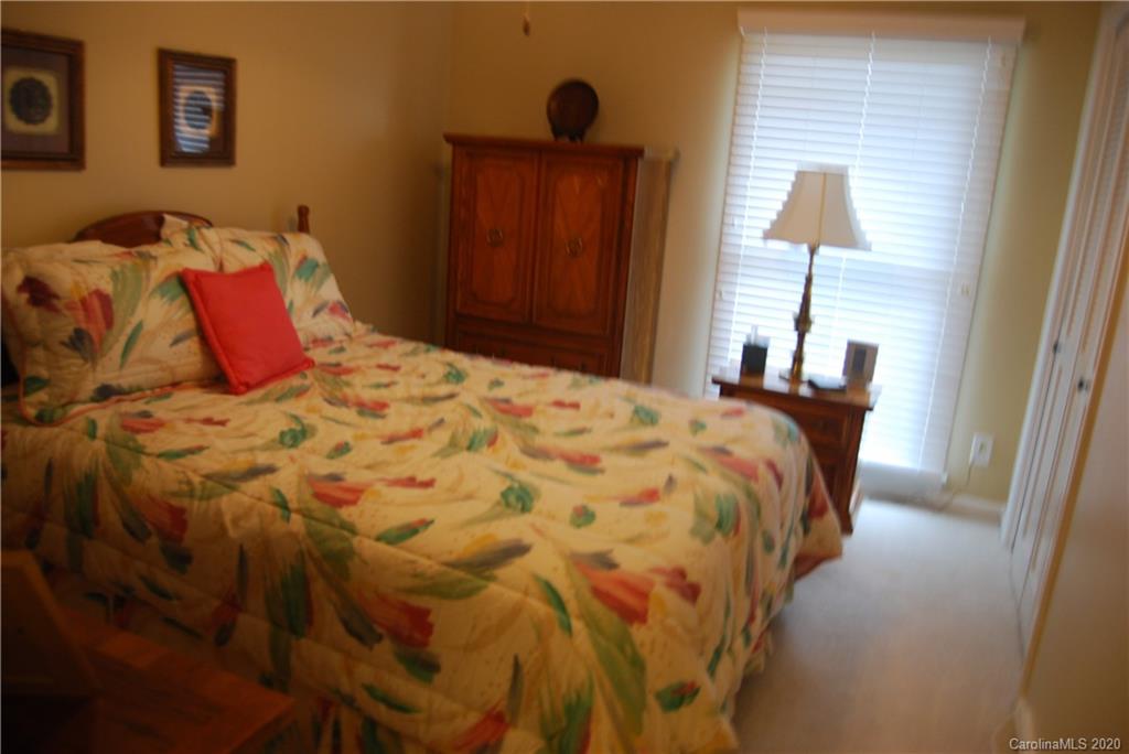 2716 Stack Road Monroe, NC 28112 - Photo 18 of 42 a bedroom with a bed and a lamp