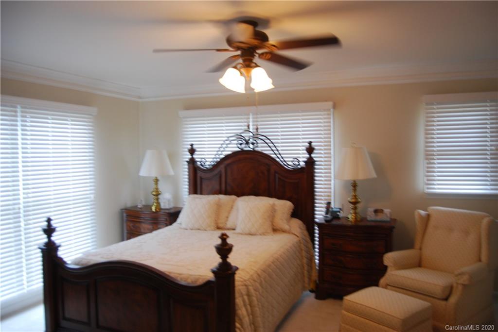 2716 Stack Road Monroe, NC 28112 - Photo 23 of 42 a bedroom with a bed and a ceiling fan