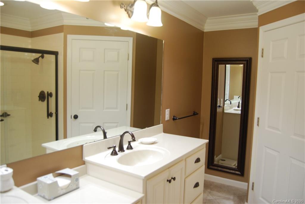 2716 Stack Road Monroe, NC 28112 - Photo 28 of 42 a bathroom with a sink and a mirror