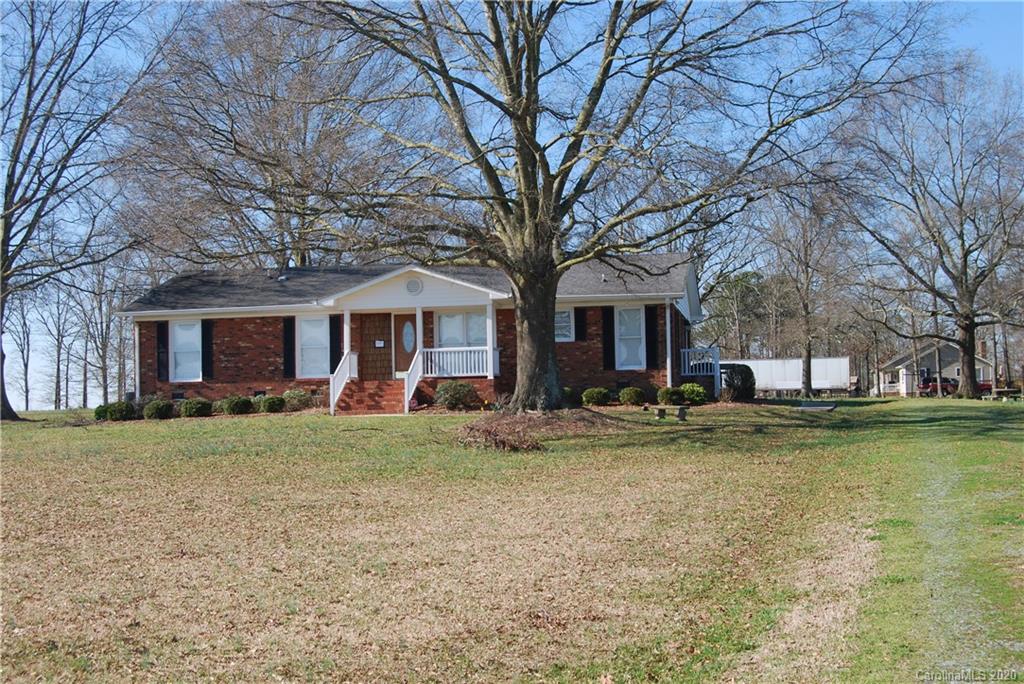 2716 Stack Road Monroe, NC 28112 - Photo 4 of 42 a view of a house with a yard and large tree