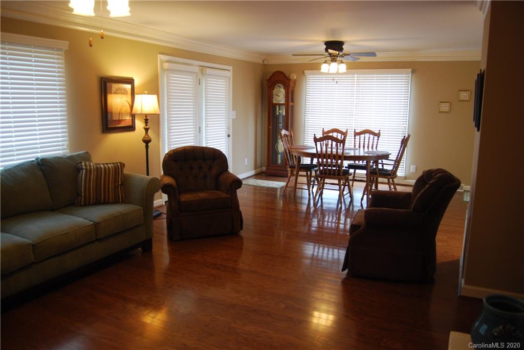 2716 Stack Road Monroe, NC 28112 - Photo 32 of 42 a living room with furniture and wooden floor