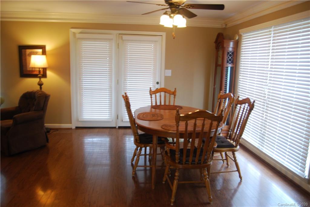 2716 Stack Road Monroe, NC 28112 - Photo 35 of 42 a view of a dining room with furniture and wooden floor