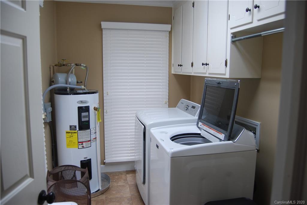 2716 Stack Road Monroe, NC 28112 - Photo 36 of 42 a view of storage and utility room with washer and dryer