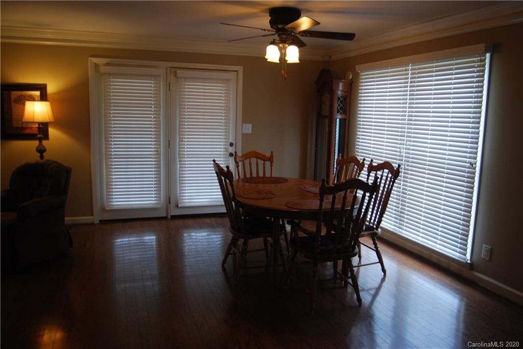 2716 Stack Road Monroe, NC 28112 - Photo 42 of 42 a view of a dining room with furniture and wooden floor