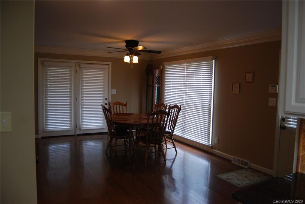 2716 Stack Road Monroe, NC 28112 - Photo 8 of 42 a view of a dining room with furniture and wooden floor