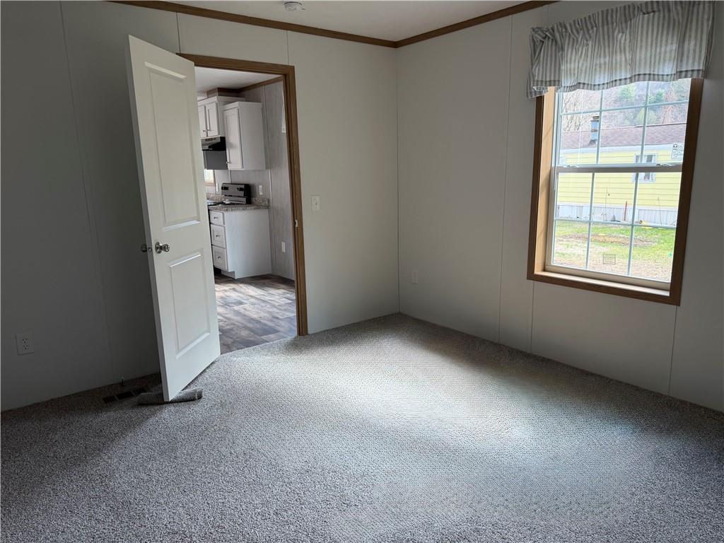 206 Iron Furnace Road East Brady, PA 16028 - Photo 11 of 12 an empty room with windows and cabinet