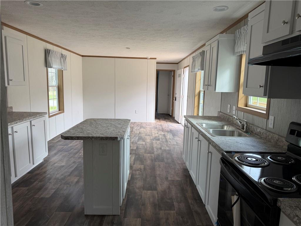 206 Iron Furnace Road East Brady, PA 16028 - Photo 5 of 12 a kitchen with stainless steel appliances granite countertop a sink stove and cabinets