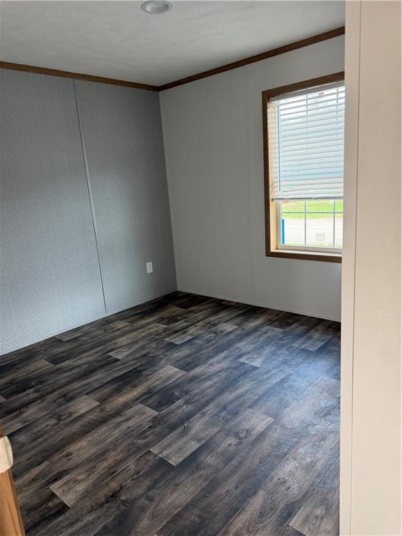 206 Iron Furnace Road East Brady, PA 16028 - Photo 7 of 12 a view of an empty room with wooden floor and a window