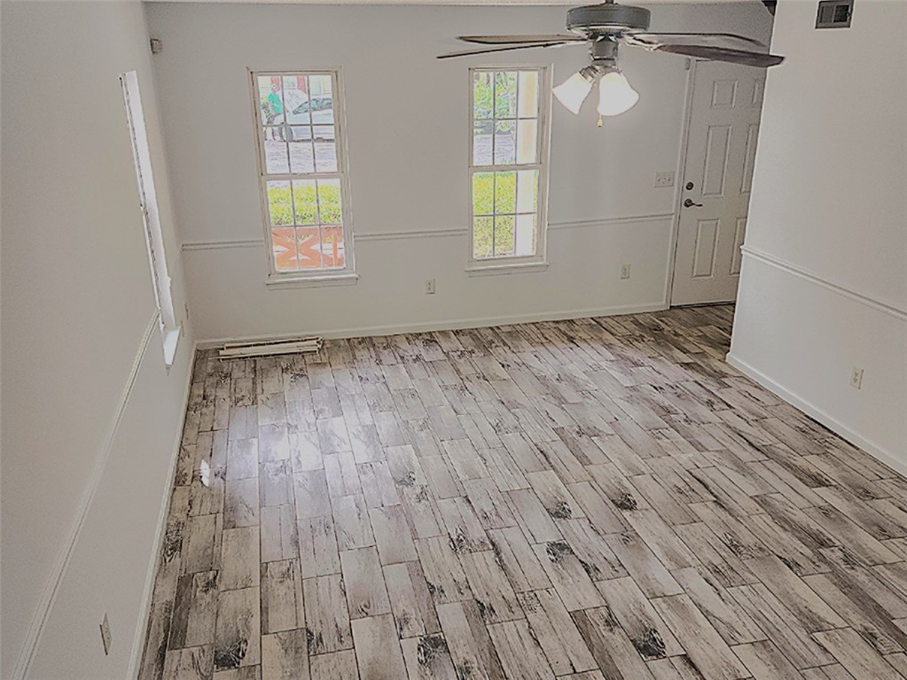328 Springfield Circle Easley, SC 29642 - Photo 4 of 29 Wood-look tile flooring flows throughout this open room, offering durability and visual interest.