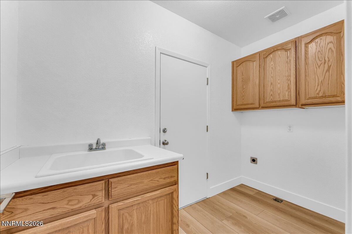 2329 Red Maple Court Reno, NV 89523 - Photo 30 of 39 a bathroom with a sink and a mirror