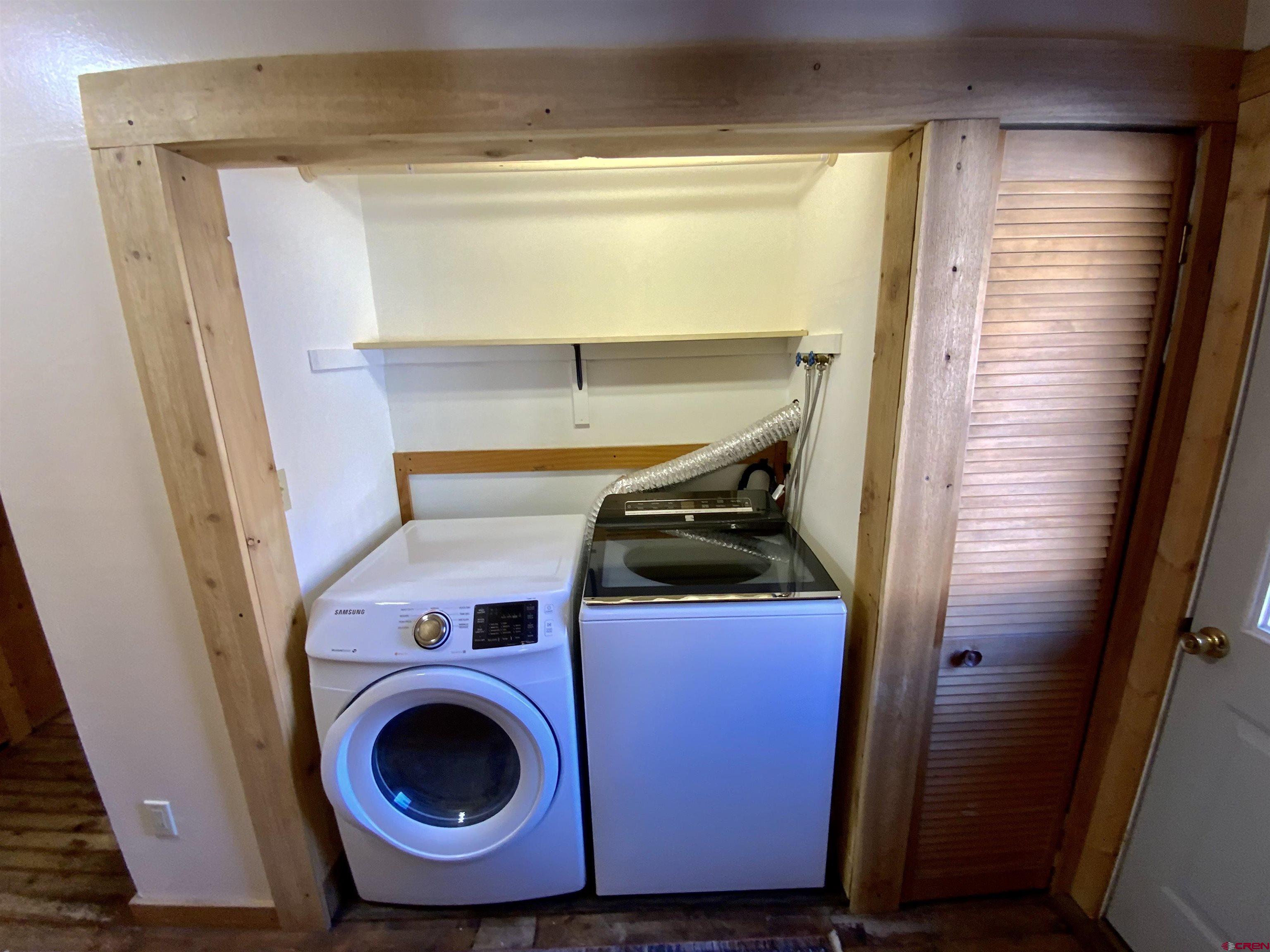 8639 County Road 76 Ohio City, CO 81237 - Photo 17 of 26 a utility room with dryer and washer