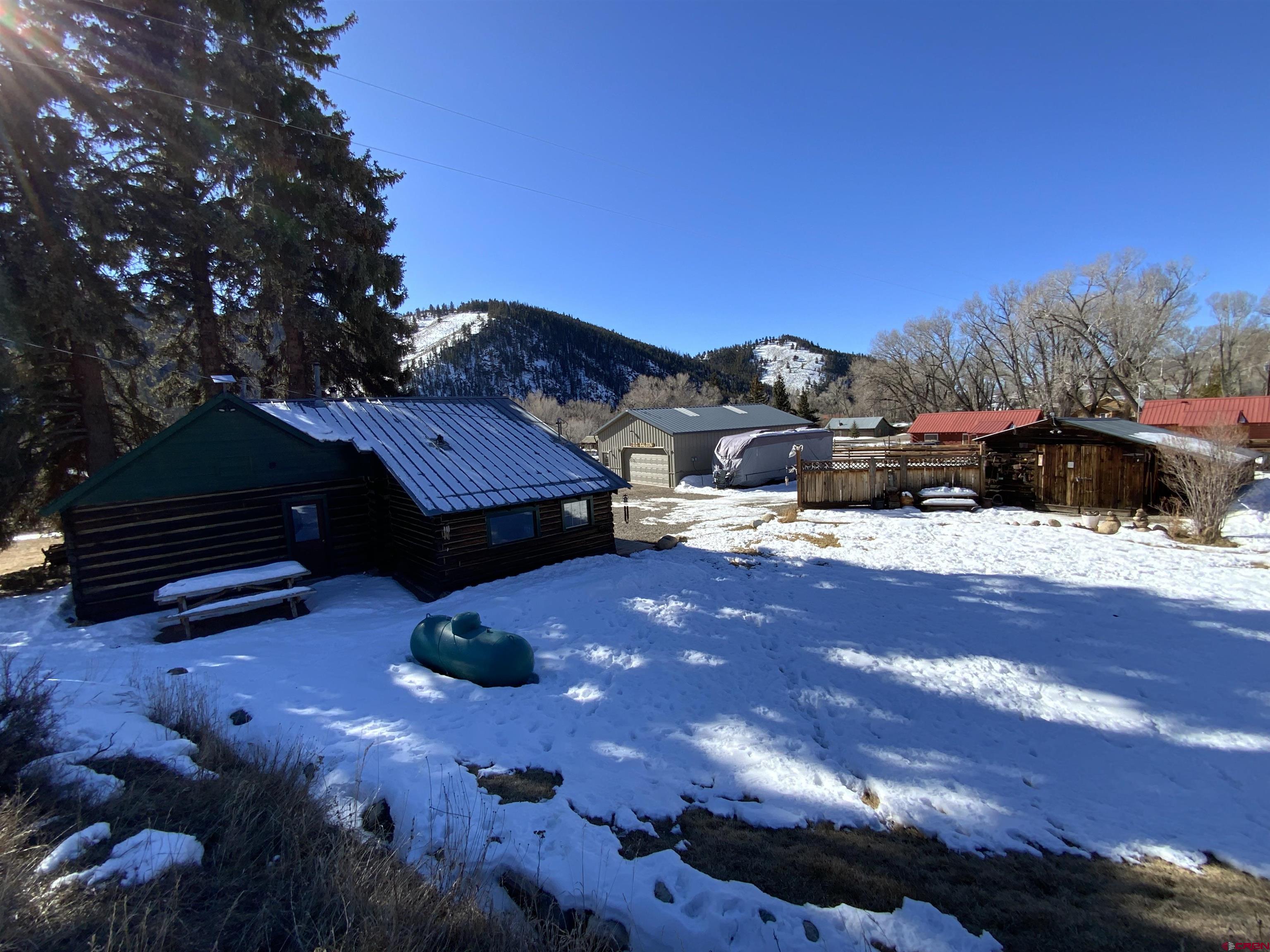 8639 County Road 76 Ohio City, CO 81237 - Photo 2 of 26 a view of a house with a yard