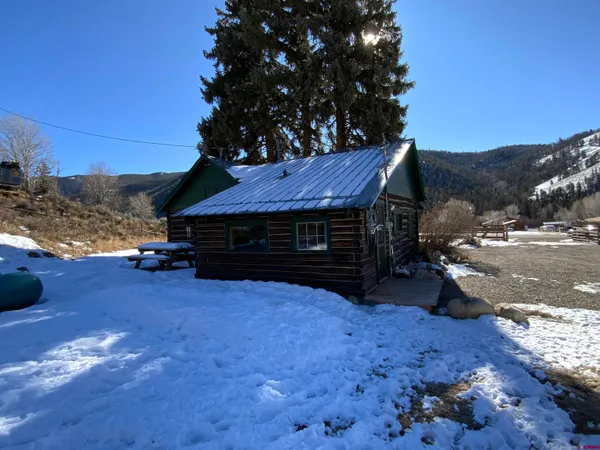 a view of house with backyard and entertaining space