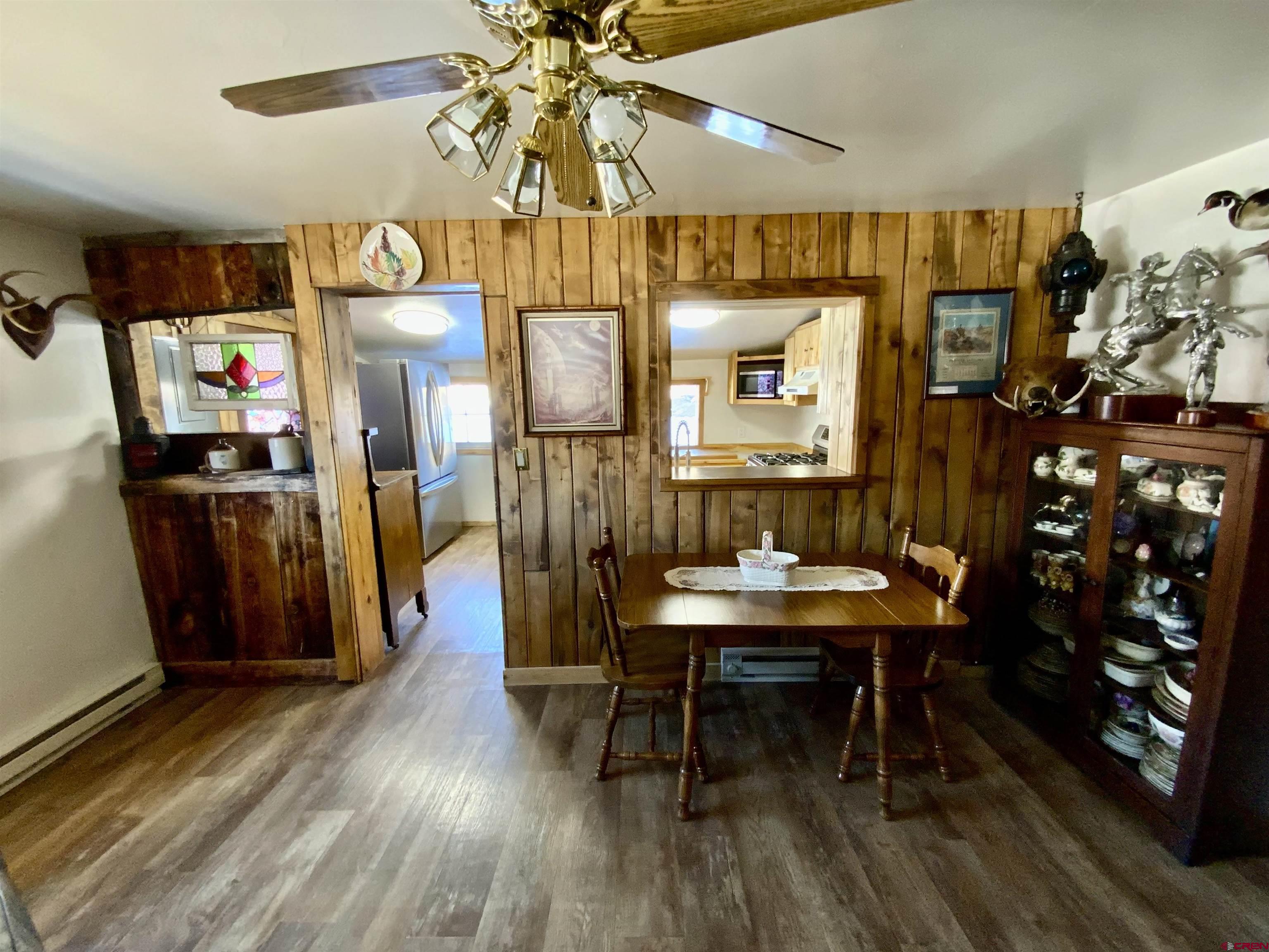 8639 County Road 76 Ohio City, CO 81237 - Photo 5 of 26 a view of a dining room with furniture and wooden floor
