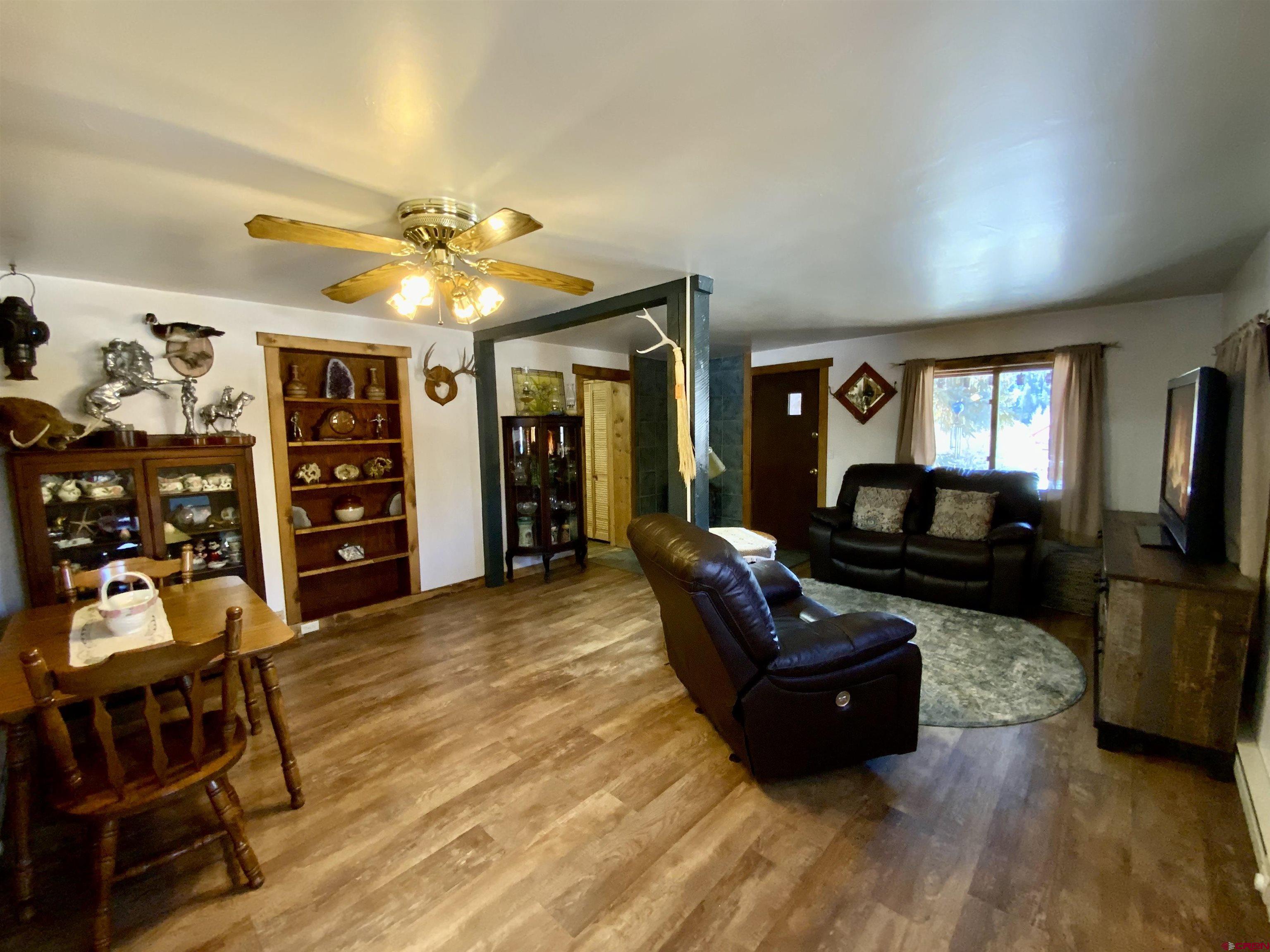8639 County Road 76 Ohio City, CO 81237 - Photo 7 of 26 a living room with furniture and a flat screen tv