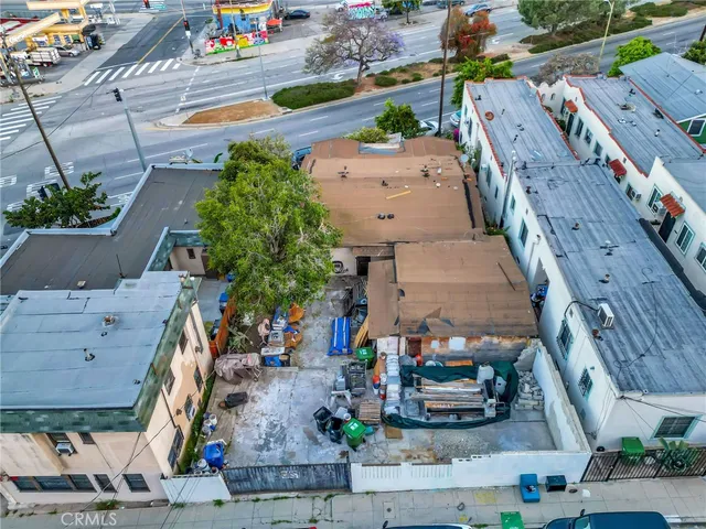 an aerial view of houses with outdoor space