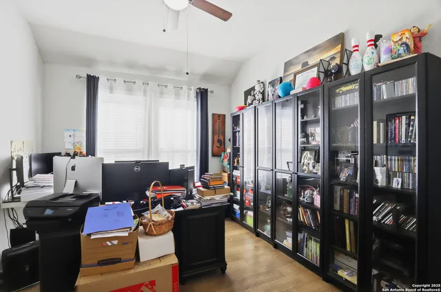 a living room with lots of furniture and a flat screen tv