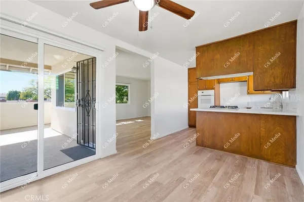 a view of a kitchen with kitchen island a counter top space