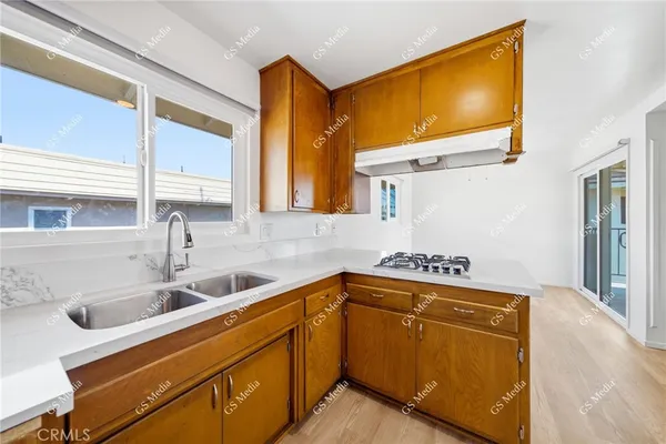 a kitchen with a sink and cabinets