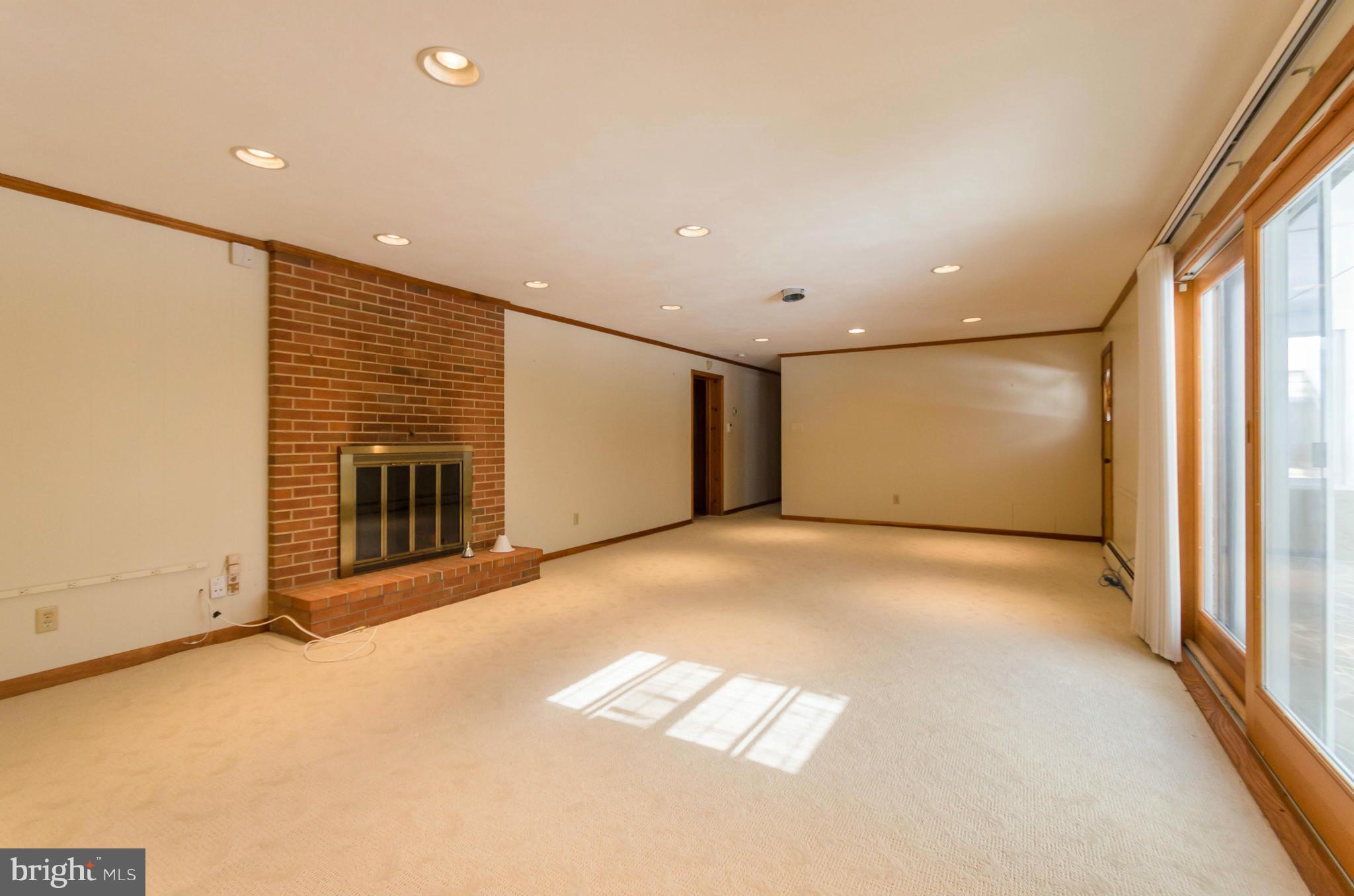 13423 Blenfield Road Phoenix, MD 21131 - Photo 23 of 30 Receation room w/ fireplace